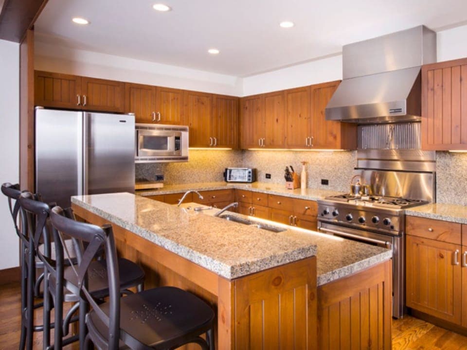 Cook like a chef in our state-of-the-art kitchen, equipped with granite countertops, stainless steel appliances, and a spacious island. Perfect for gourmet meal preparation.