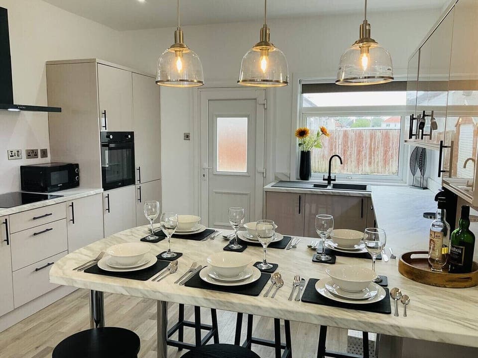 Kitchen is equipped with a washing machine, dishwasher, microwave, oven, grill, fridge and freezer.