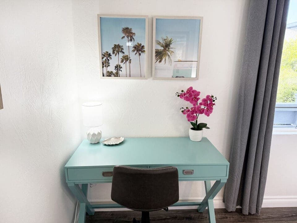 Dedicated workspace with natural light and inspiring beachy decor—great for remote work or planning your day in San Diego.
