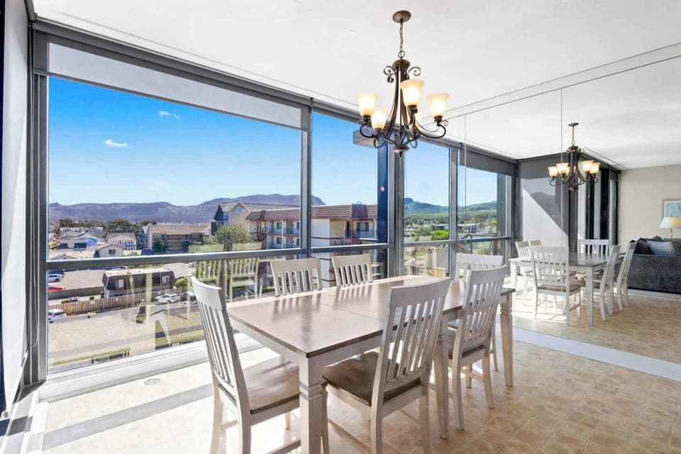 Modern comfort, amazing vistas! Stylish dining room designed for enjoying meals and the scenery.