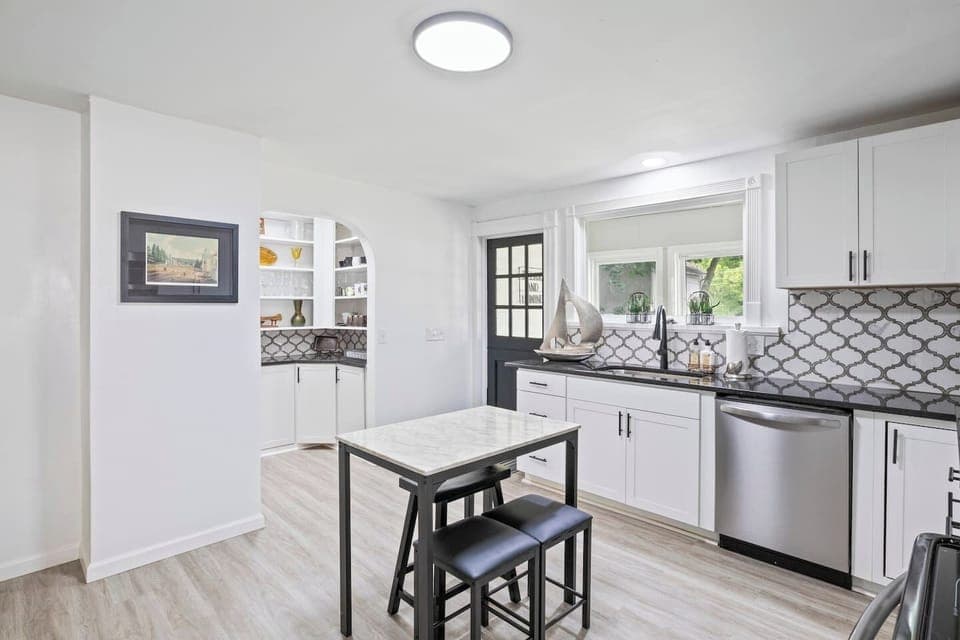 Sleek kitchen with marble-top island and plenty of counter space ✨ Perfect for cooking and entertaining in Canandaigua.