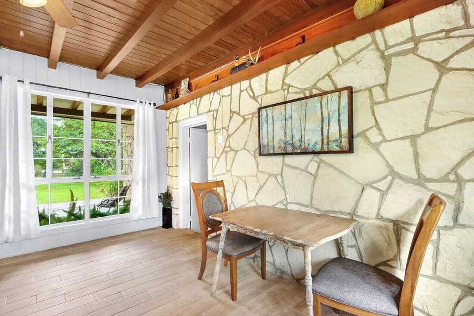 Primary room is located behind the seating area in the second living room