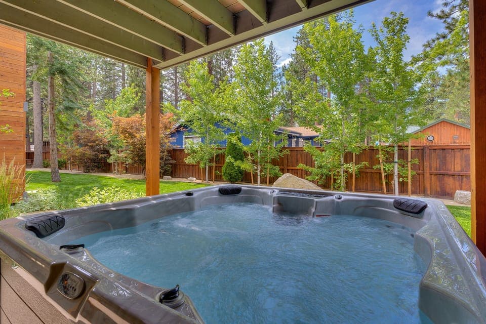 - Private hot tub for relaxation under the covered deck  
- Surrounded by trees and peaceful fenced backyard views  
- Perfect retreat after skiing, hiking or exploring Lake Tahoe