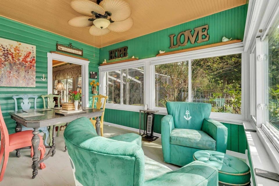 Unwind in the charming set of emerald blue chairs - an ideal spot to relax and enjoy the serene surroundings!