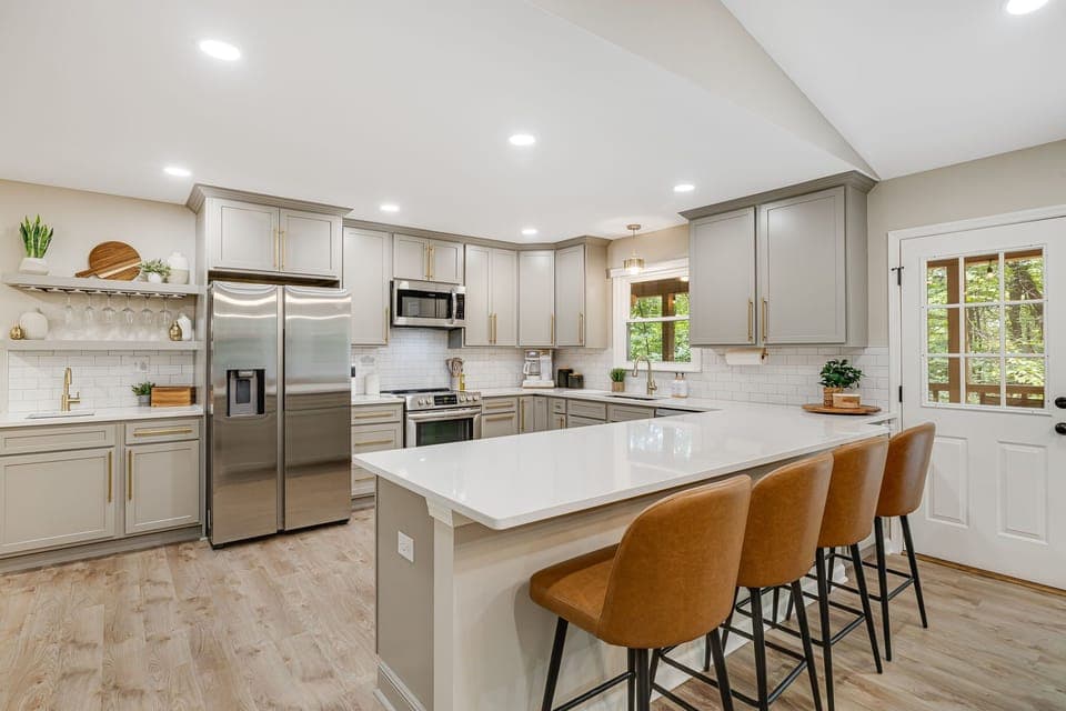 Experience our newly renovated kitchen. With modern appliances, ample counter space, and stylish decor, this space invites you to create and enjoy delicious meals during your stay.