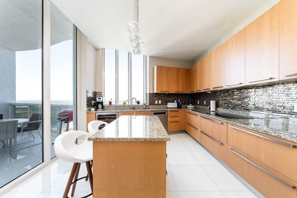 Open kitchen with balcony access.