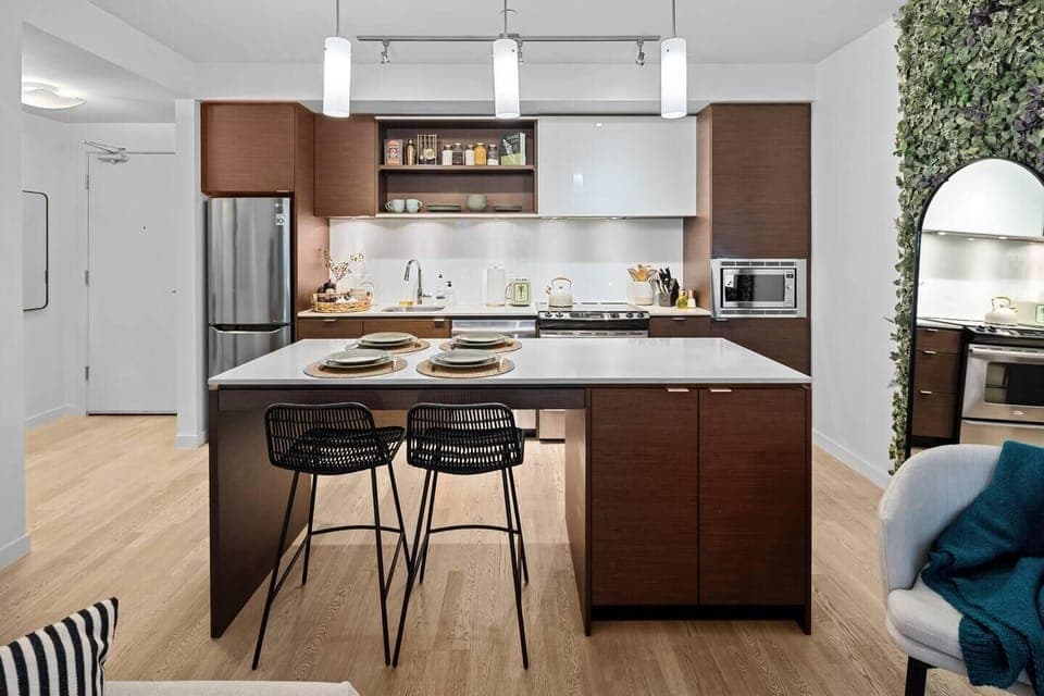 Modern kitchen with cozy breakfast bar seating for two