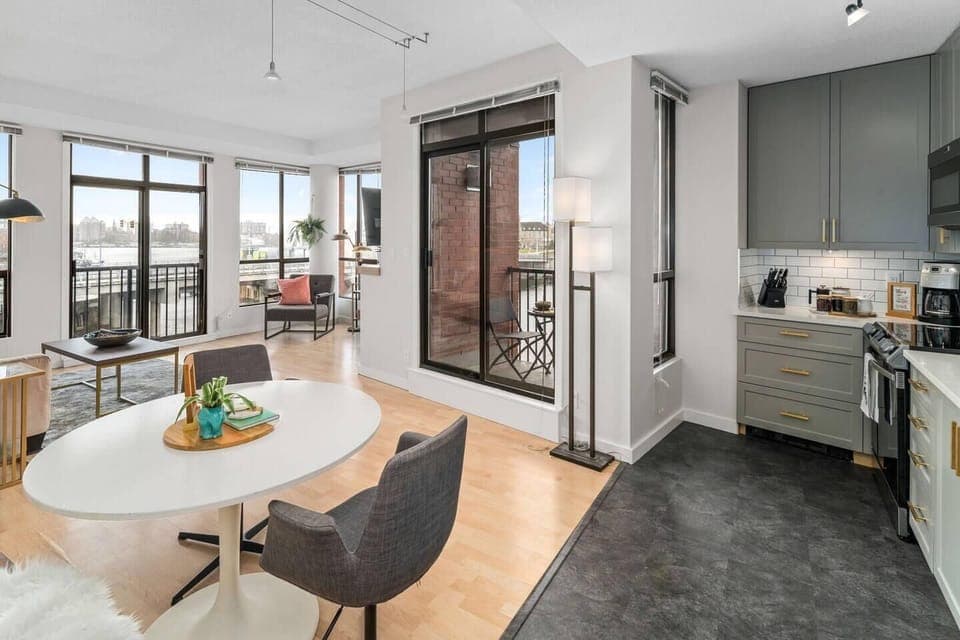 Bright dining area with city views and kitchen amenities
