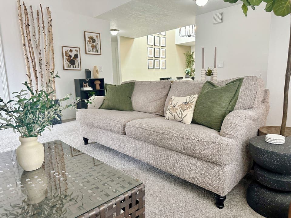 Cozy living room with a fireplace and 60” smart TV. 