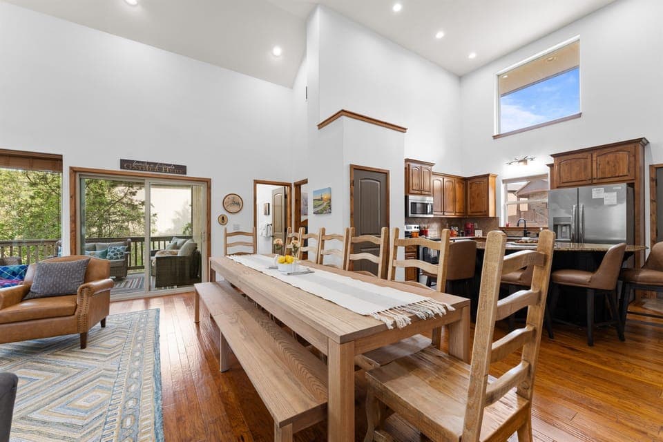 There is space for 12 people at the custom 10 ft table, plus 4 counter seats at the kitchen island. You can sit 16 people for a meal in one space.