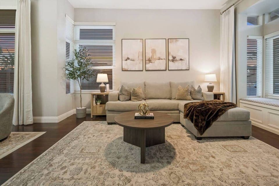 Living room with cozy chaise sofa with a queen size sofa bed.