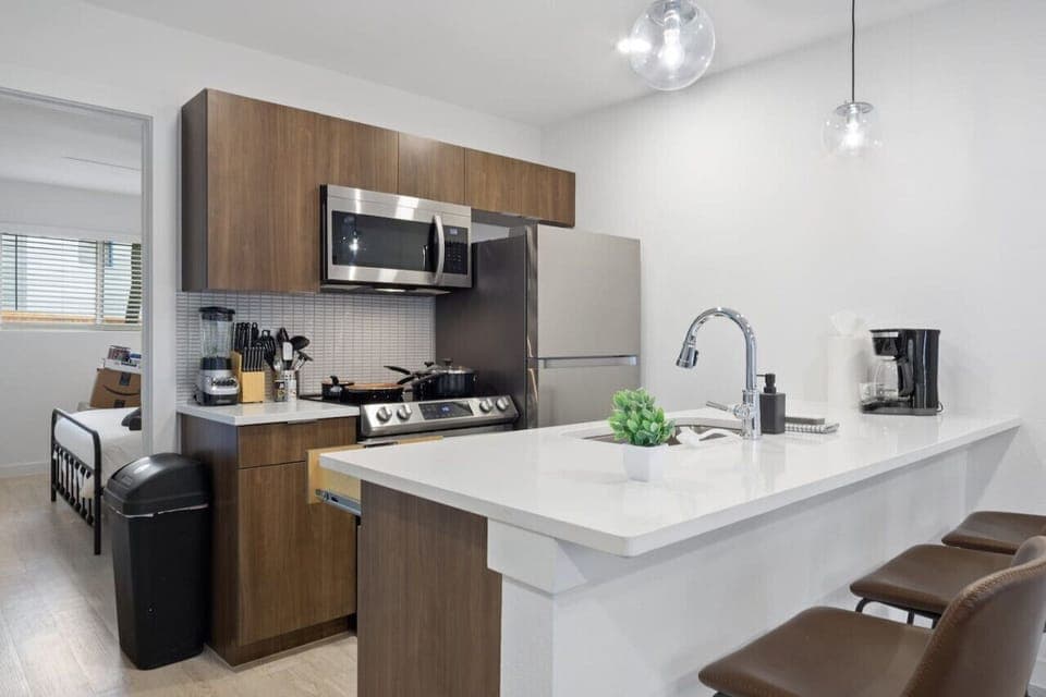 You’ll love the convenience of this fully equipped kitchen, where you can brew coffee, cook meals, or prepare snacks. The cozy layout and warm ambiance make cooking here a delightful part of your stay.