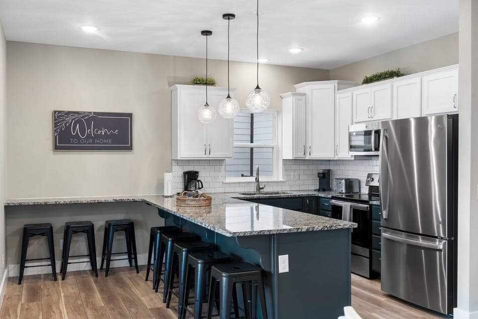 Fully Equipped Kitchen with Upgraded Appliances and Extra Bar Seating