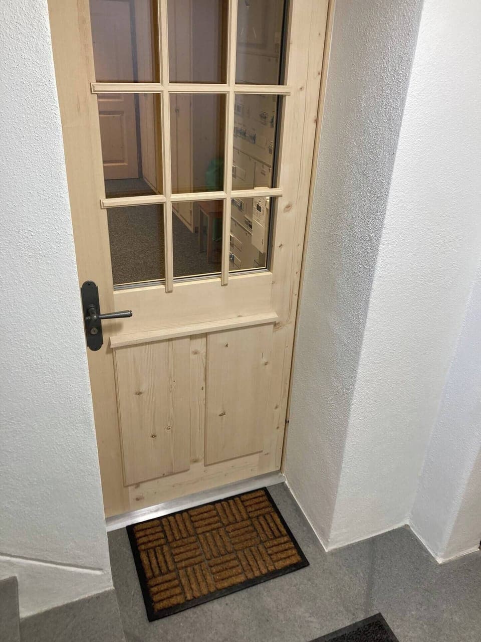 Downstairs at the stairs is the entrance to the wardrobe.
