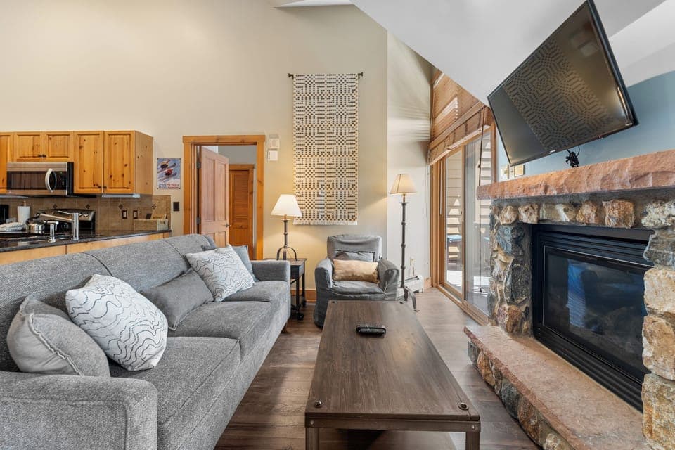 Living area with vaulted ceilings and flatscreen TV