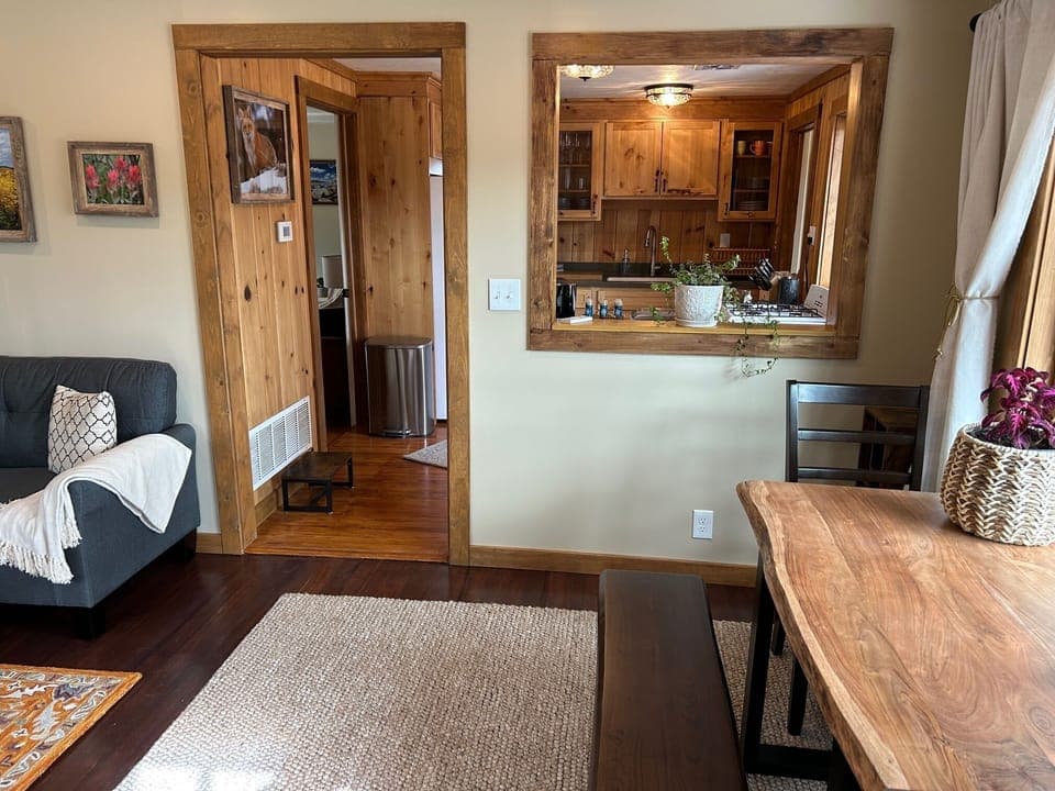 Living room entry, interior window into kitchen