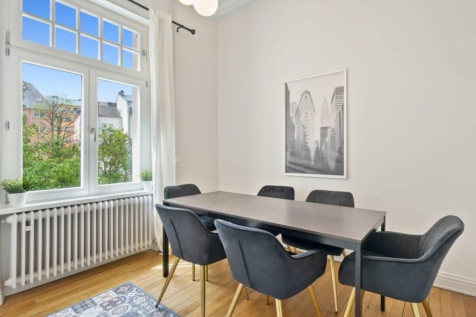 A bright, spacious dining area with comfortable seating for six, perfect for meals and gatherings.