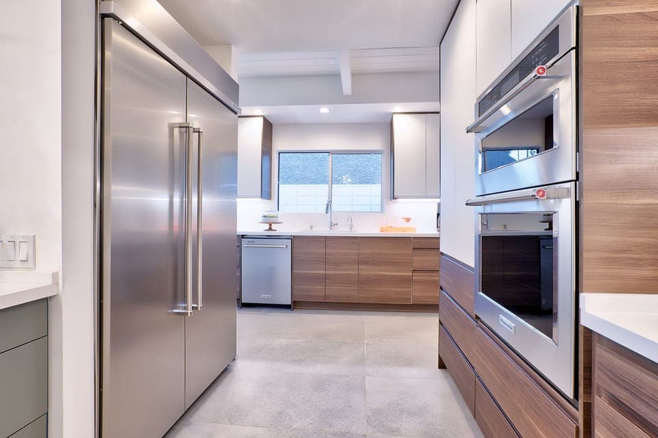 New kitchen- 10' island. KitchenAid gas range, 48" fridge/freezer, 2 D/Ws.