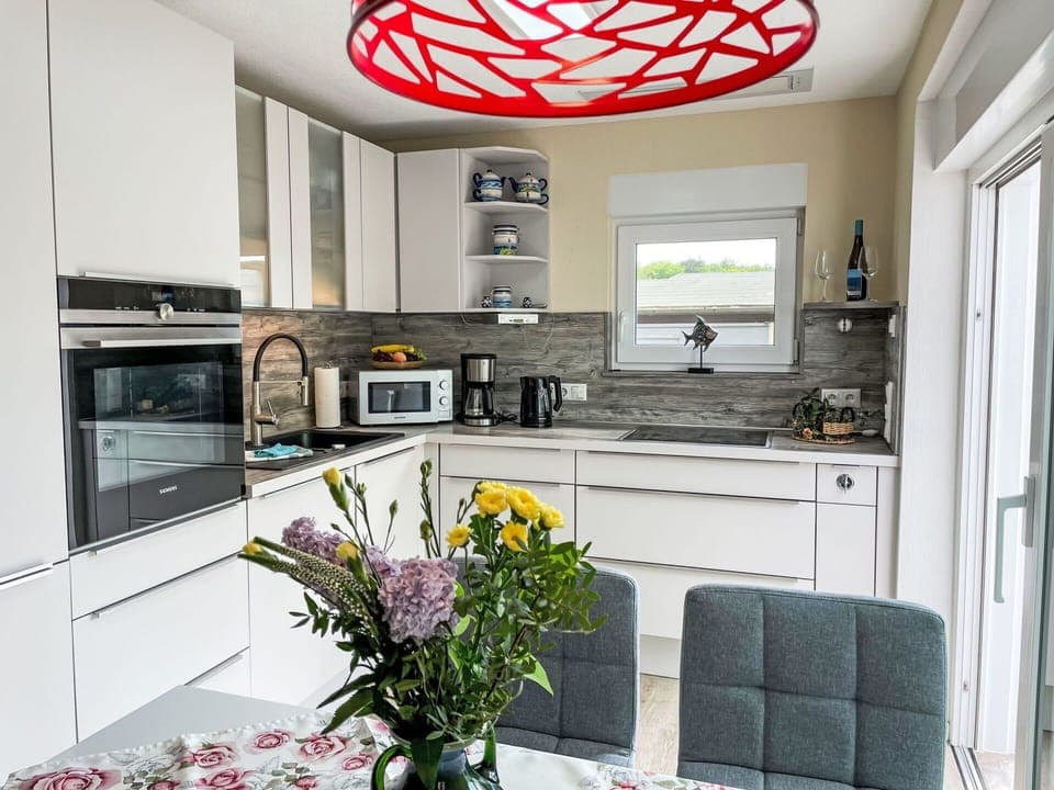 Cabinetry, Countertop, Furniture, Plant, Kitchen Appliance, Flower, Kitchen Stove, Kitchen, Home Appliance, Interior Design