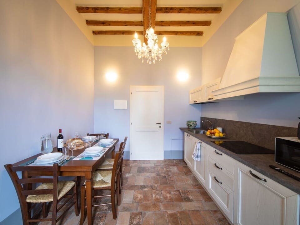 Table, Cabinetry, Furniture, Property, Countertop, Wood, Lighting, Interior Design, Chair, Flooring