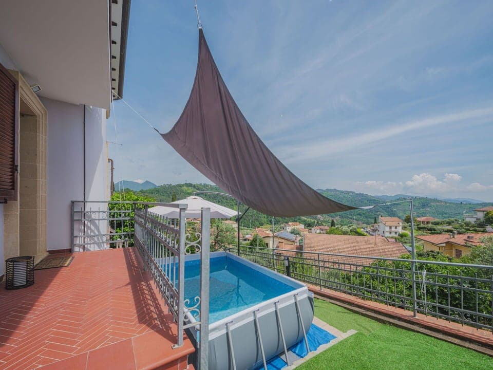 Sky, Plant, Cloud, Property, Building, Shade, Swimming Pool, Outdoor Furniture, House, Urban Design