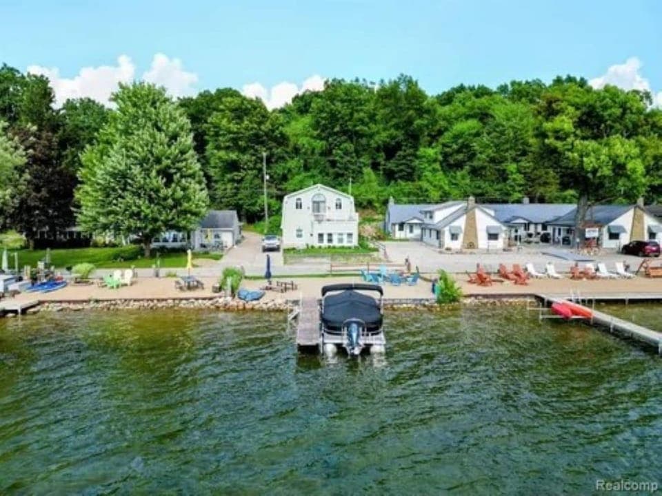View of dock and house, boat is not available.