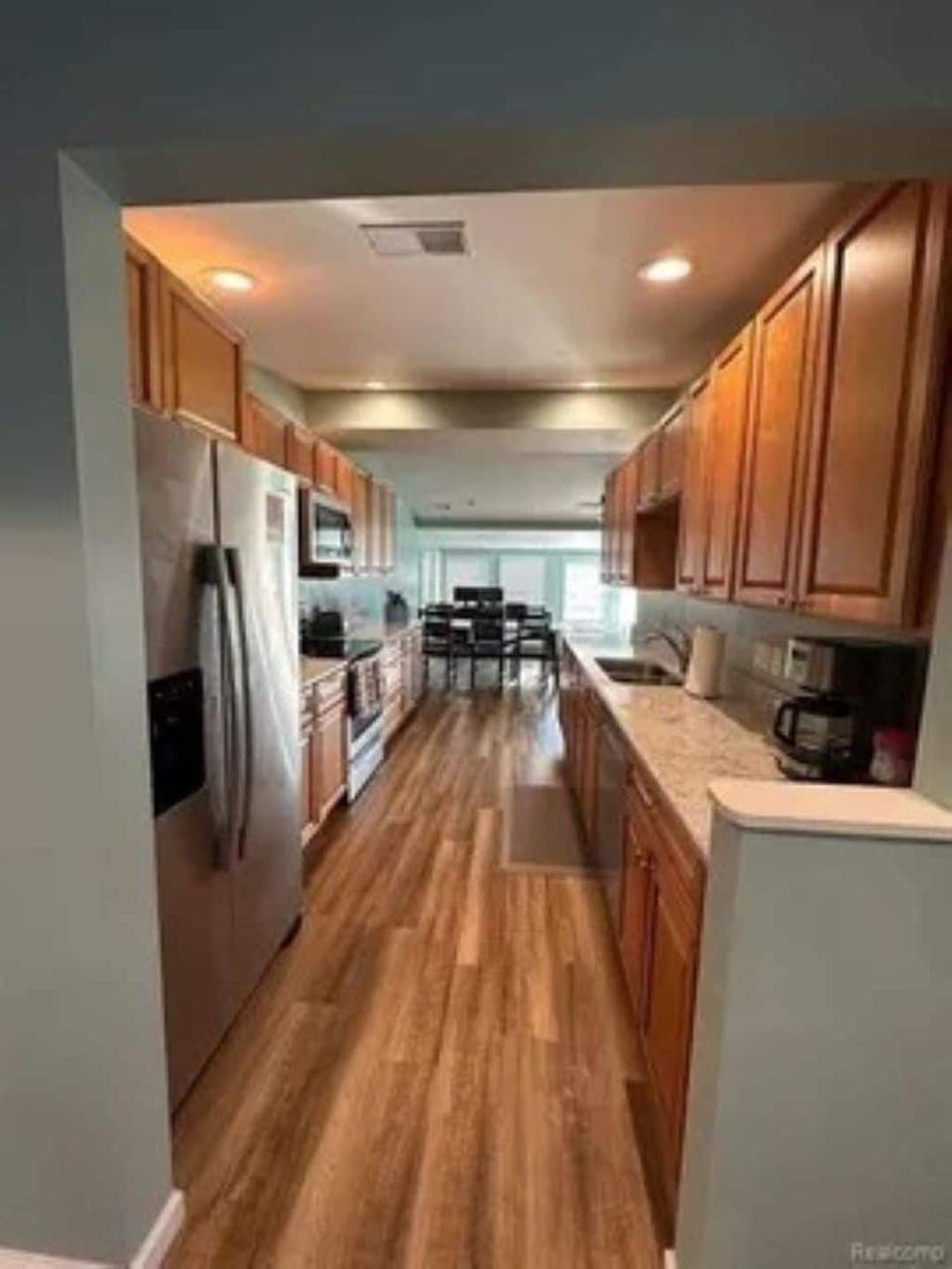 The Gourmet kitchen is stocked with  lots of small appliances and cookware.
