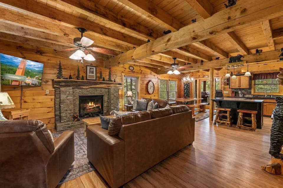 Living area with leather seating, gas fireplace, and Smart TV