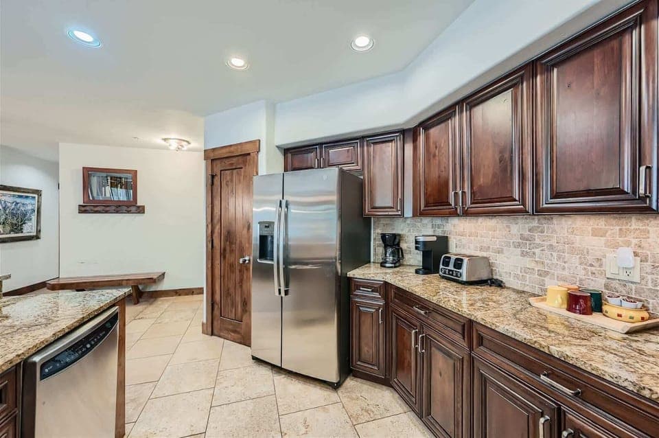 The open, elegant kitchen offers ample space & all the comforts of home
