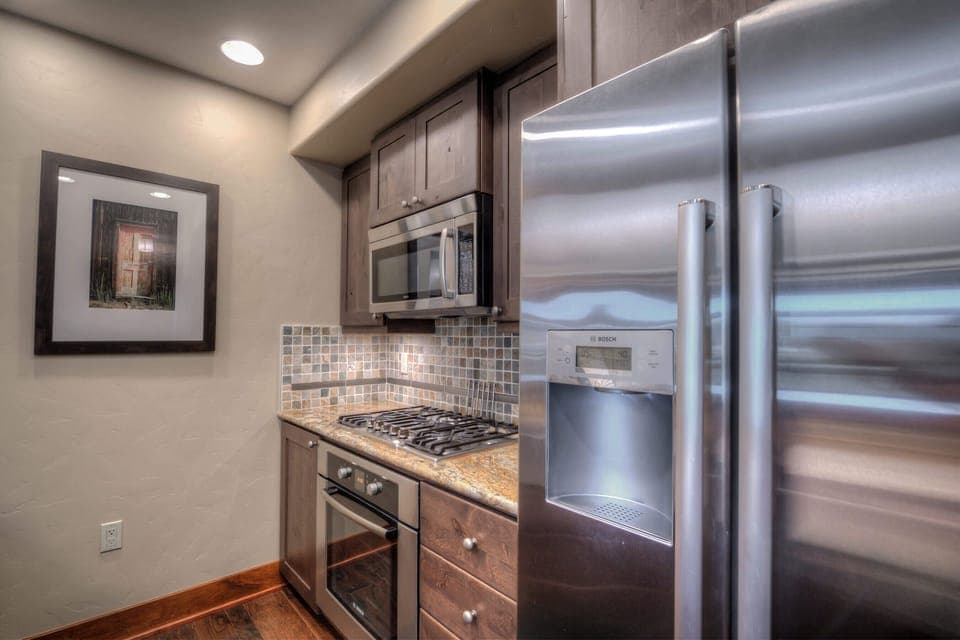 Kitchen with drip coffee maker, toaster, blender, slow cooker, and more