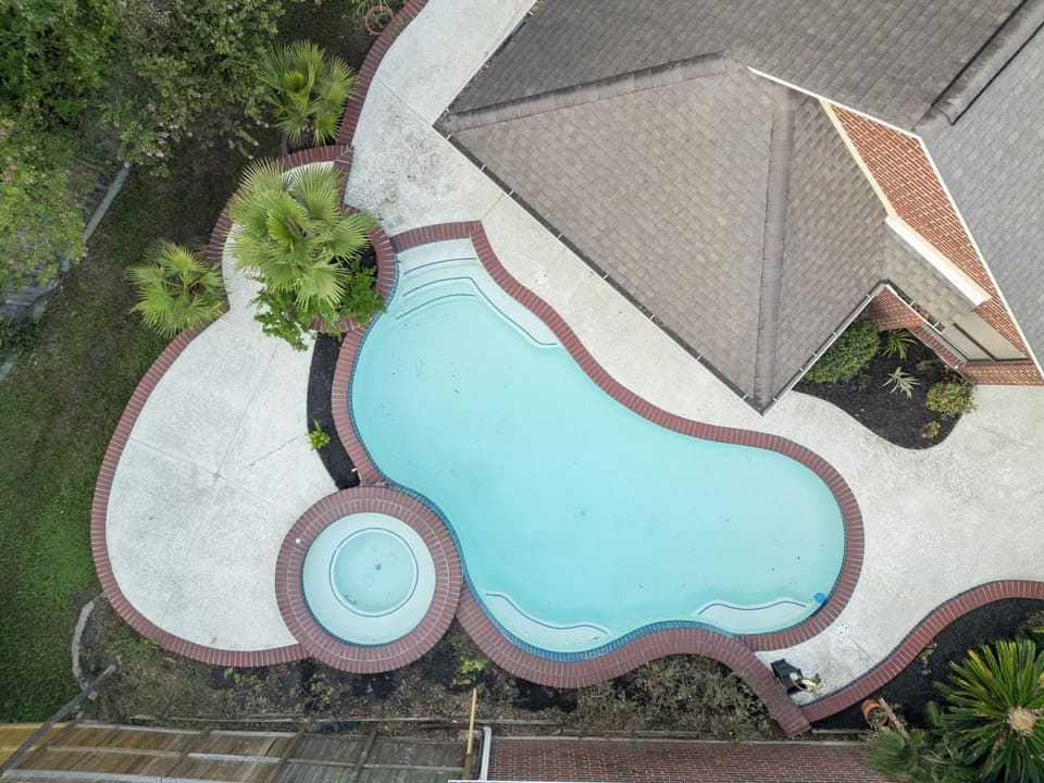 Hidden oasis pool home is a luxury private retreat in Friendswood