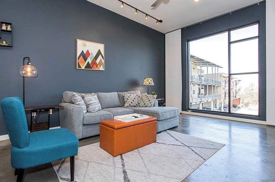 Open living space with Smart TV, and balcony