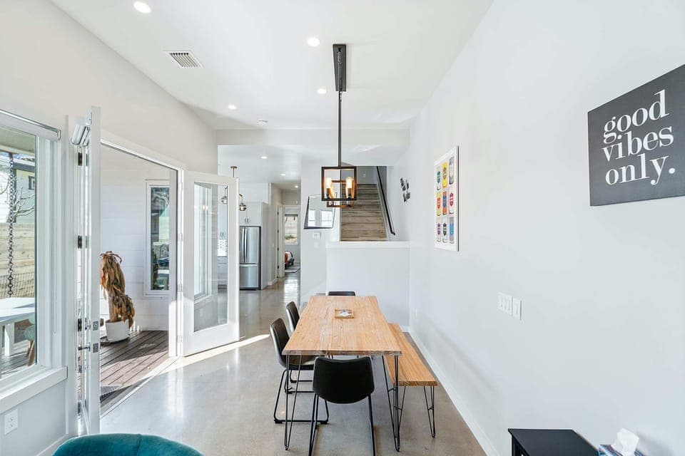 Gather for elegant meals together at the dining table, with space for 7