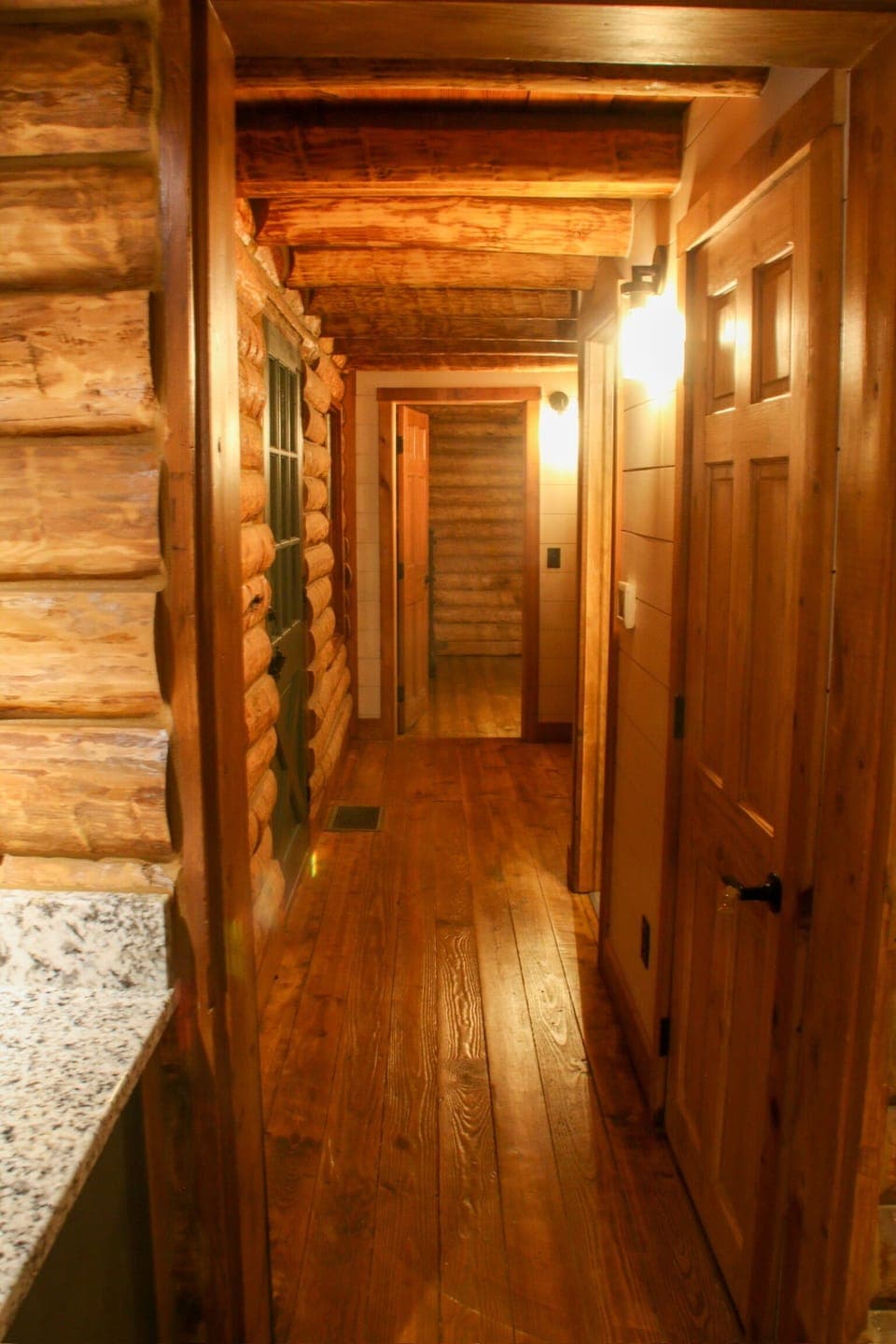 Hallway to powder room, laundry and master suite