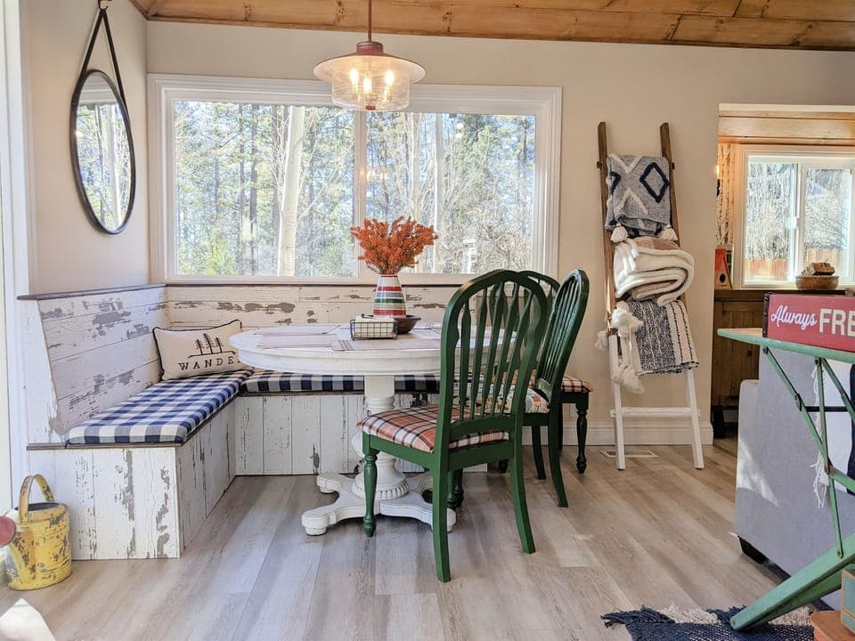 The dining nook in our main cabin has seating for 7-8 guests