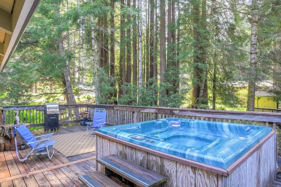 Hot tub with gas BBQ grill and lounge chairs