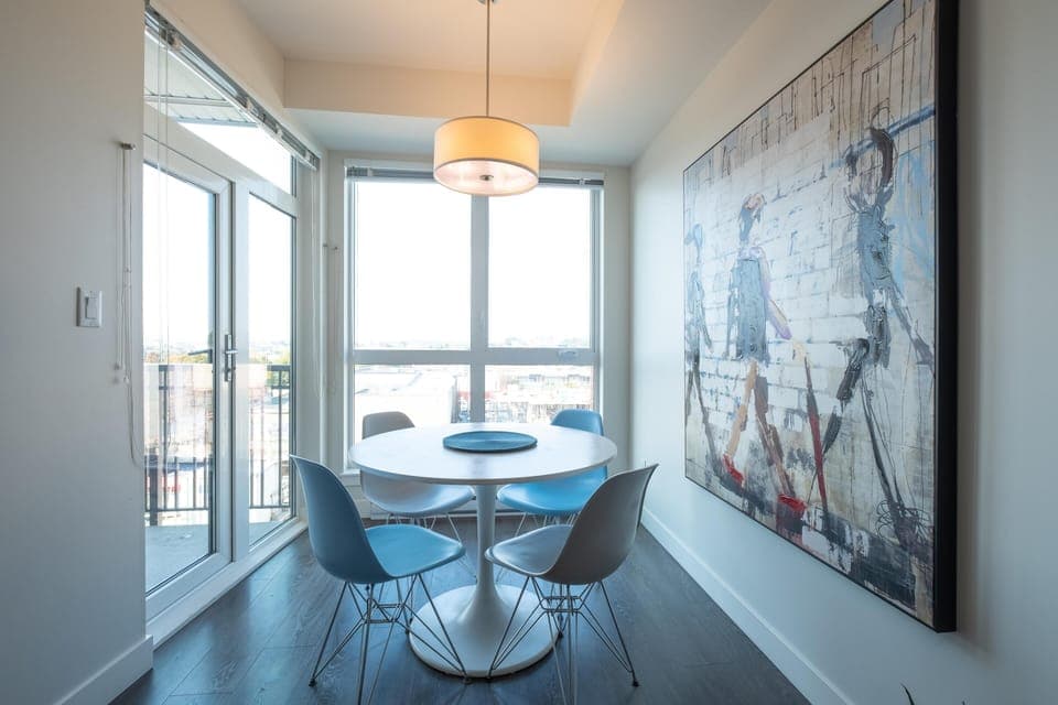 Dining for four with panoramic city views and modern flair