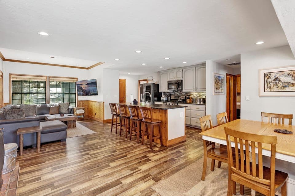 Fully equipped cabin kitchen with ample cabinetry, stove, fridge, microwave, and coffee maker—perfect for cooking meals, morning coffee, and feeling right at home on your stay.