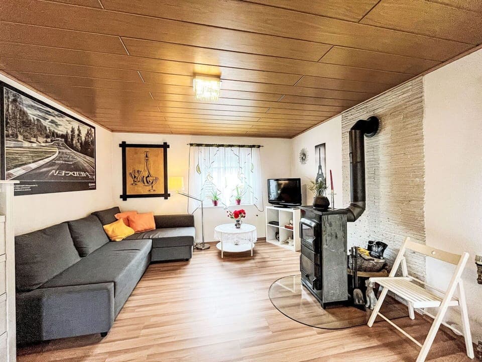 Furniture, Couch, Wood, Flooring, Building, Floor, Picture Frame, Chair, Studio Couch, Laminate Flooring