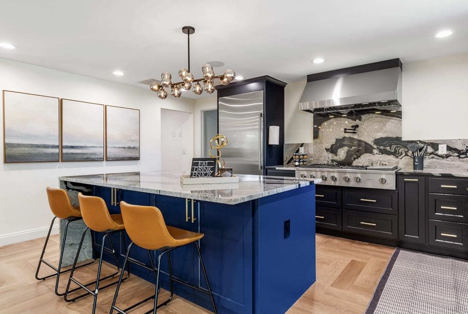 Modern kitchen with a spacious island and chic barstools, ideal for casual dining or entertaining.