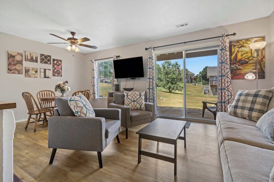 Spacious living room with access to patio