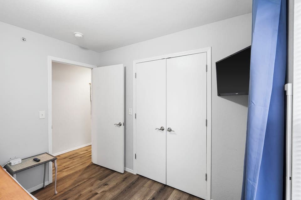 The second bedroom features a twin-over-full bunkbed & Smart TV