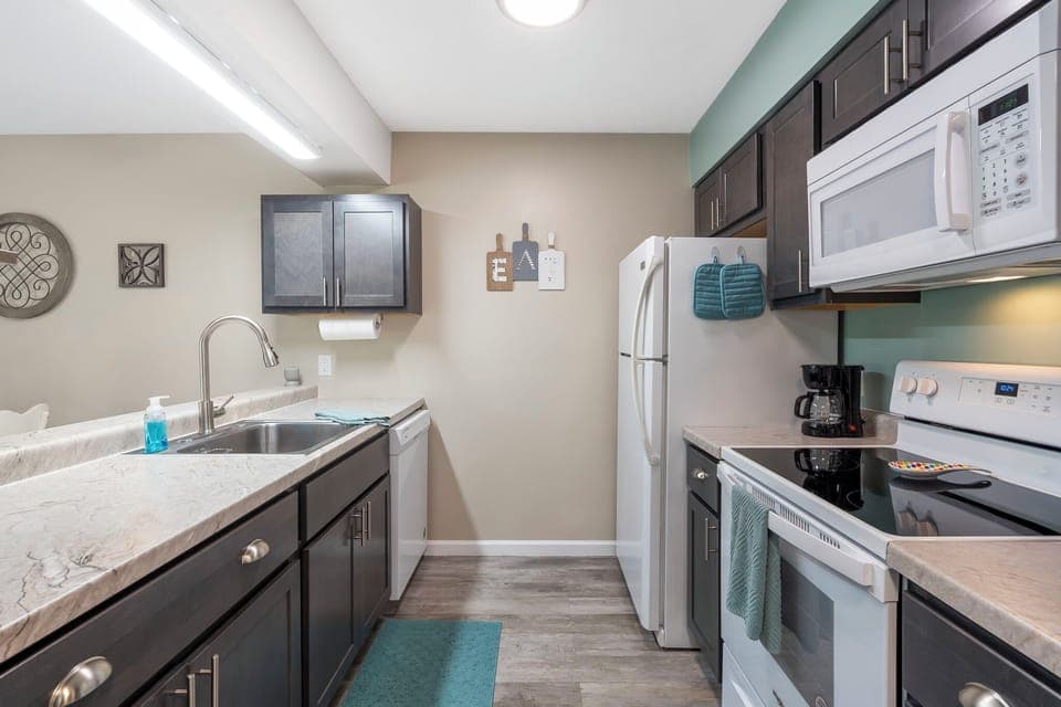 The open, airy kitchen offers ample space & all the comforts of home