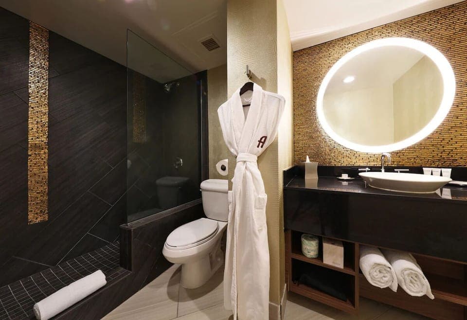 Refresh in a sleek walk-in shower with spa-style vanity glow