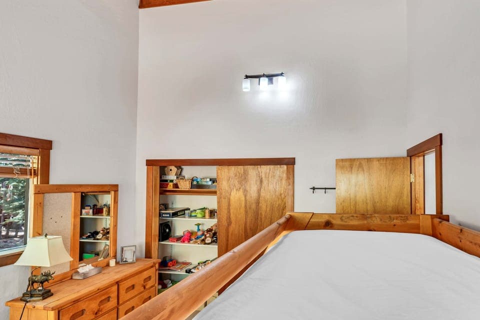 Bedroom 3: Twin-over-full bunk bed, twin trundle bed, closet, dresser, children’s books, toys, games, main floor