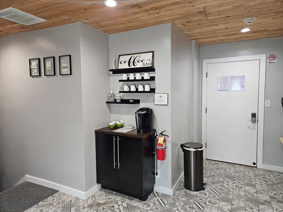 The main bedroom is to your left and the kitchen is to your right when you enter this door.