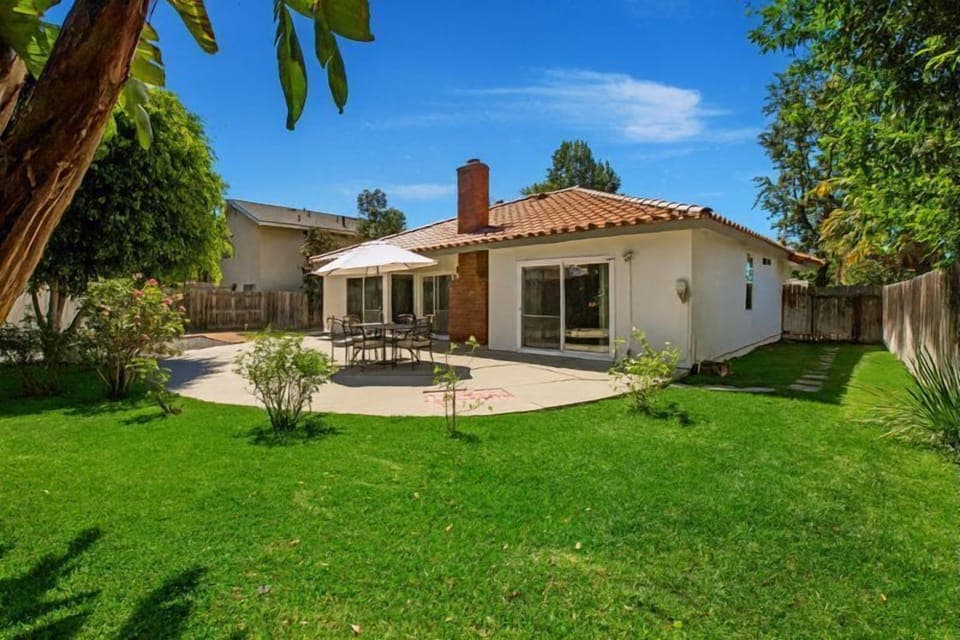 Private green backyard and outdoor sitting area 