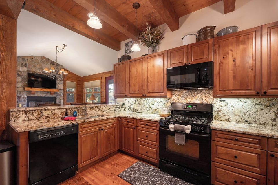 - Fully equipped kitchen with granite counters and stove   - Ample cabinets, dishwasher and microwave for guests   - Cook favorite recipes in this inviting wood-style space