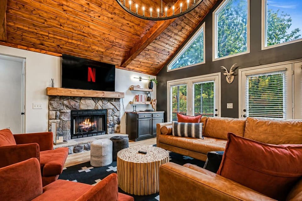 This stunning retreat features a gorgeous wood and bean ceiling, coxy gas fireplace, a luxurious leather section and spacious dining area with seating for 12. 
