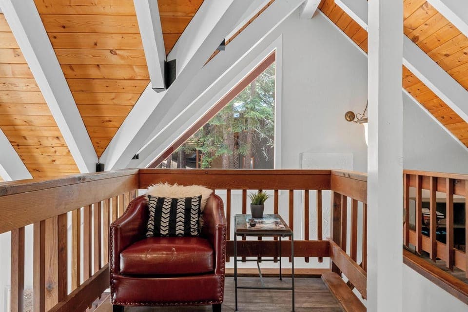 2nd floor bonus living area with foosball table and TV comfy chair seating